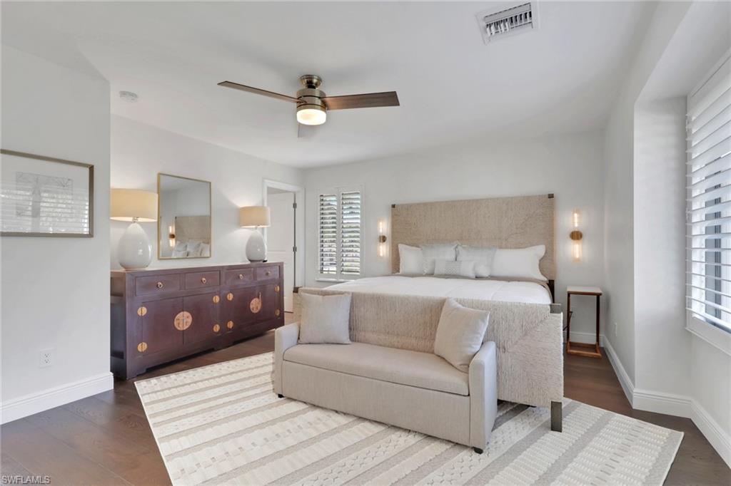 605 8th Avenue South, Unit 605 Naples, FL 34102 - Photo 25 of 50 Bedroom featuring a ceiling fan and dark wood-type flooring