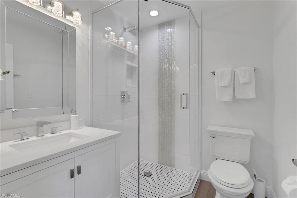 605 8th Avenue South, Unit 605 Naples, FL 34102 - Photo 27 of 50 Bathroom with vanity and a stall shower