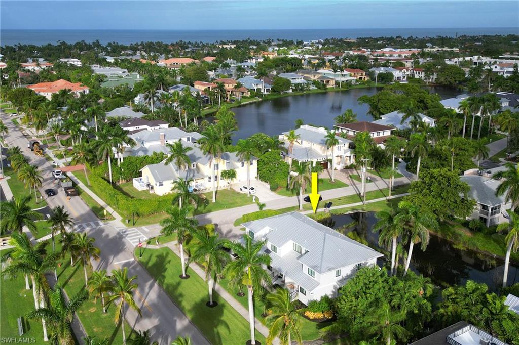 605 8th Avenue South, Unit 605 Naples, FL 34102 - Photo 41 of 50 Aerial view of residential area featuring a nearby body of water