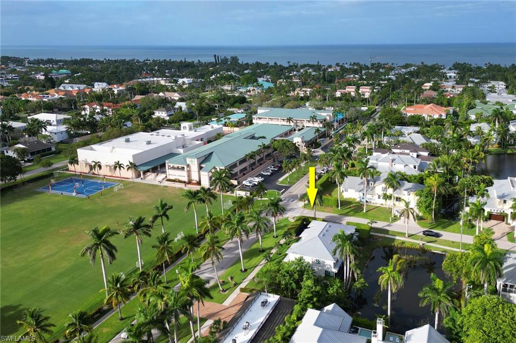 605 8th Avenue South, Unit 605 Naples, FL 34102 - Photo 43 of 50 Aerial view of residential area with a large body of water