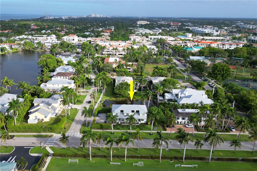 605 8th Avenue South, Unit 605 Naples, FL 34102 - Photo 46 of 50 Aerial overview of property's location with a large body of water and nearby urban area