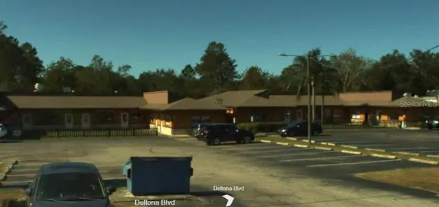 a view of a fountain in front of the house