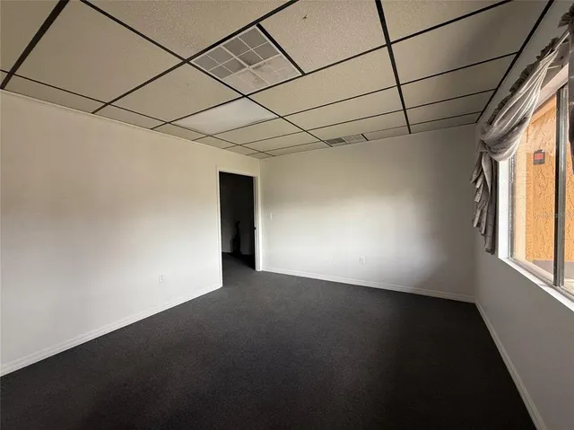 a view of an empty room with a window