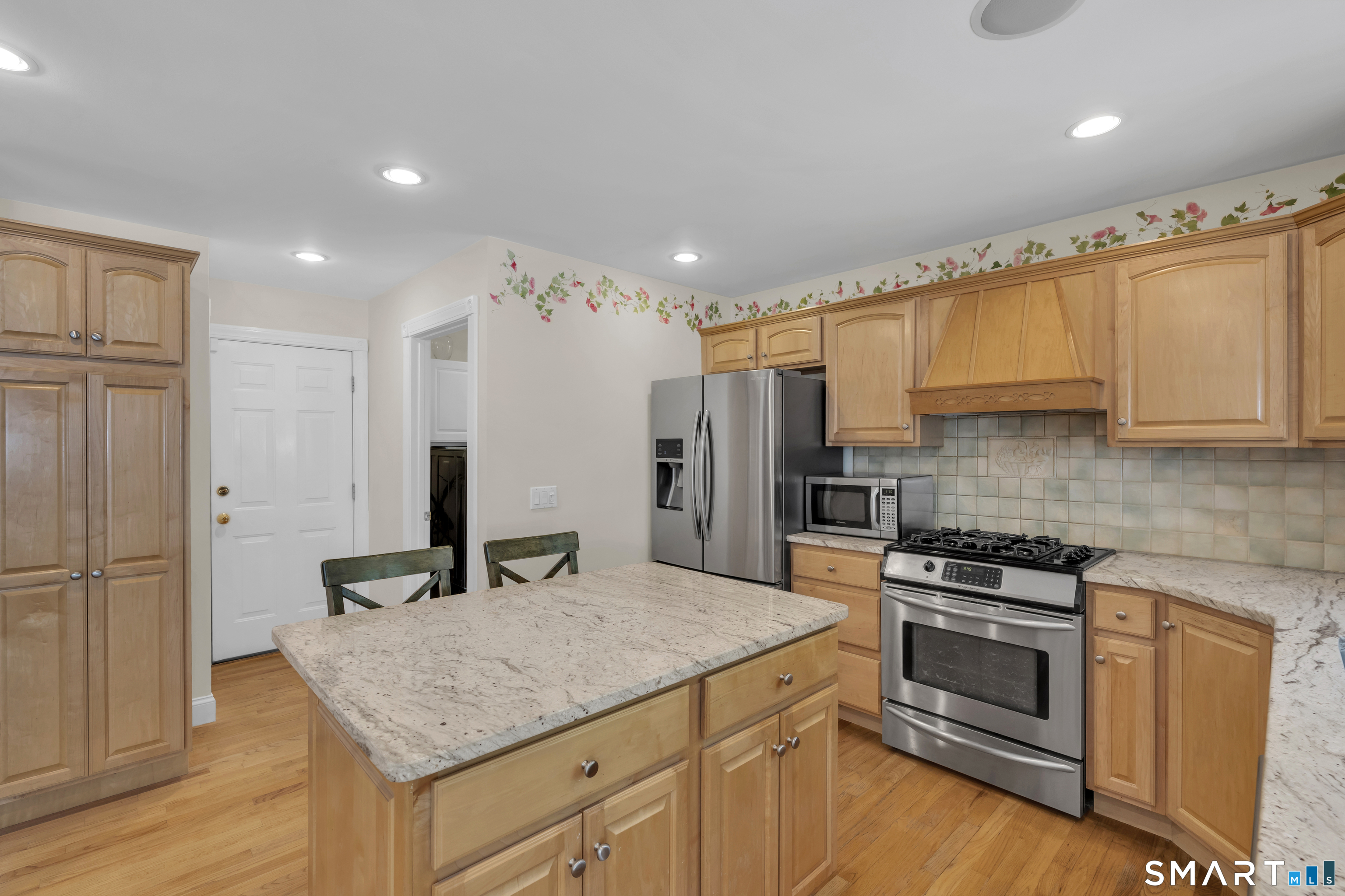 21 Stone Wall Road Salem, CT 06420 - Photo 14 of 38 a kitchen with stainless steel appliances granite countertop a stove a sink and a refrigerator