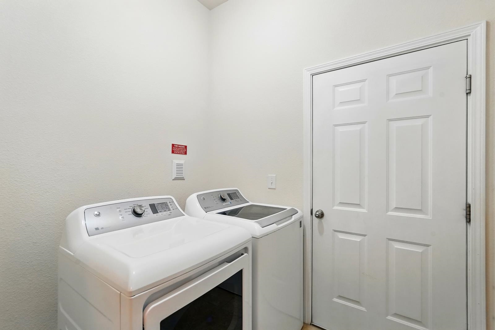 2103 Golden Lake Loop St. Augustine, FL 32084 - Photo 16 of 44 a utility room with dryer and washer
