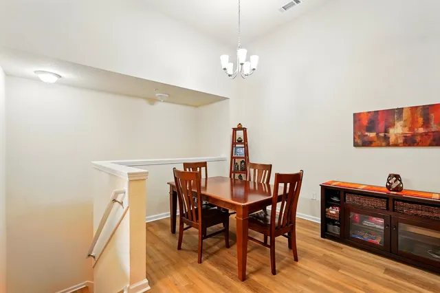 a kitchen with stainless steel appliances granite countertop a refrigerator a stove a sink and a microwave