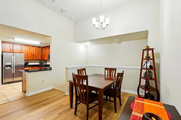 a living room with furniture a window and a flat screen tv