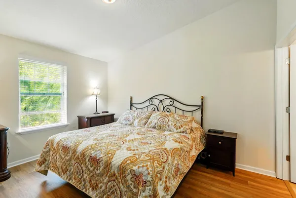 a bedroom with a bed and a television