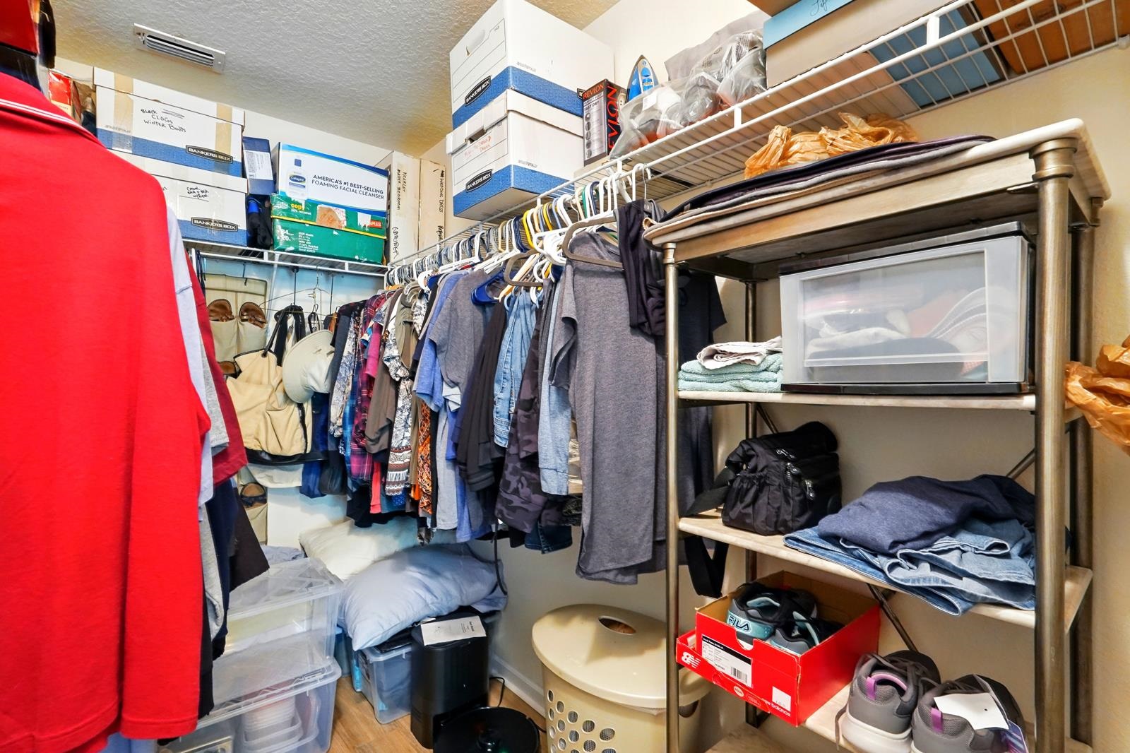 2103 Golden Lake Loop St. Augustine, FL 32084 - Photo 37 of 44 a view of walk in closet with clothes and shoes