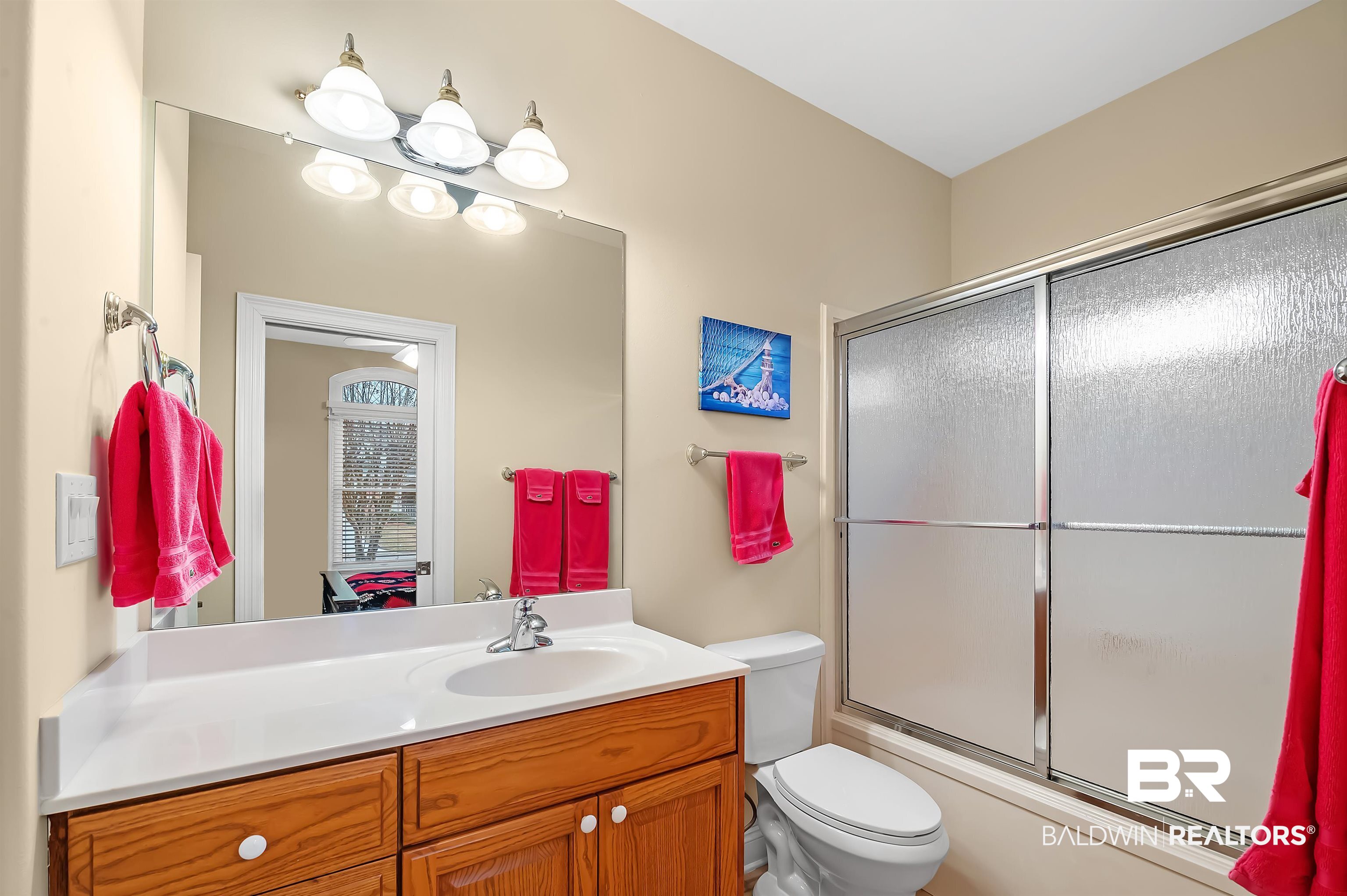 22726 Inverness Way Foley, AL 36535 - Photo 42 of 51 Full bathroom with toilet, vanity, and combined bath / shower with glass door