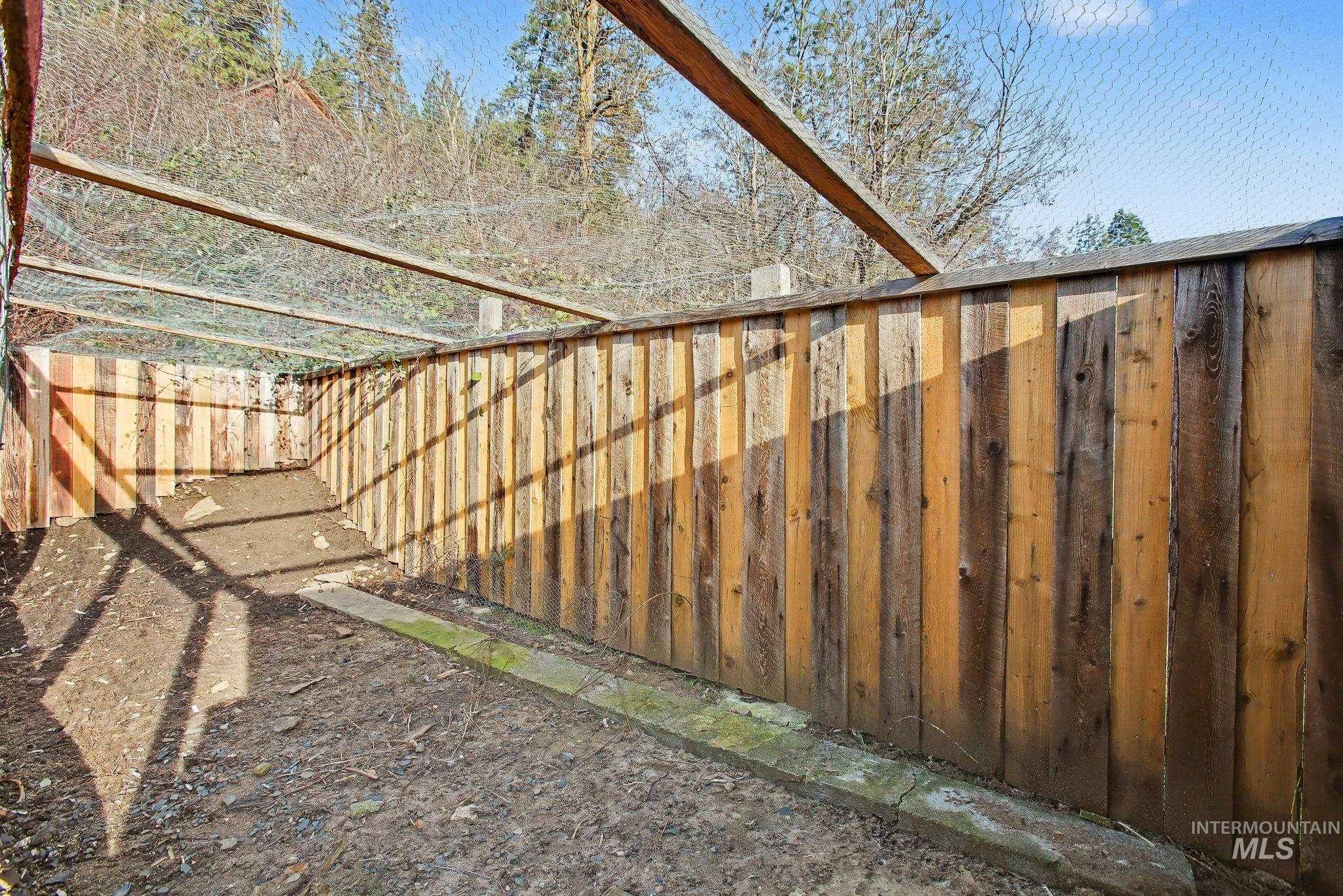 150 Elm Street Orofino, ID 83544 - Photo 33 of 36 Enclosed outdoor structure featuring natural wood fencing and overhead wire mesh