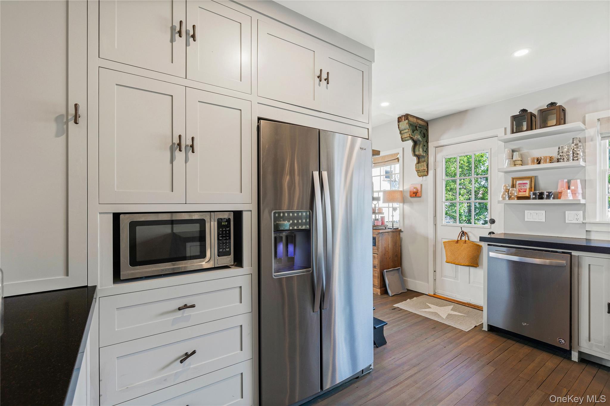 321 Rye Beach Avenue Rye, NY 10580 - Photo 19 of 36 Kitchen with stainless steel appliances, white cabinetry, open shelves, dark wood-style floors, and recessed lighting