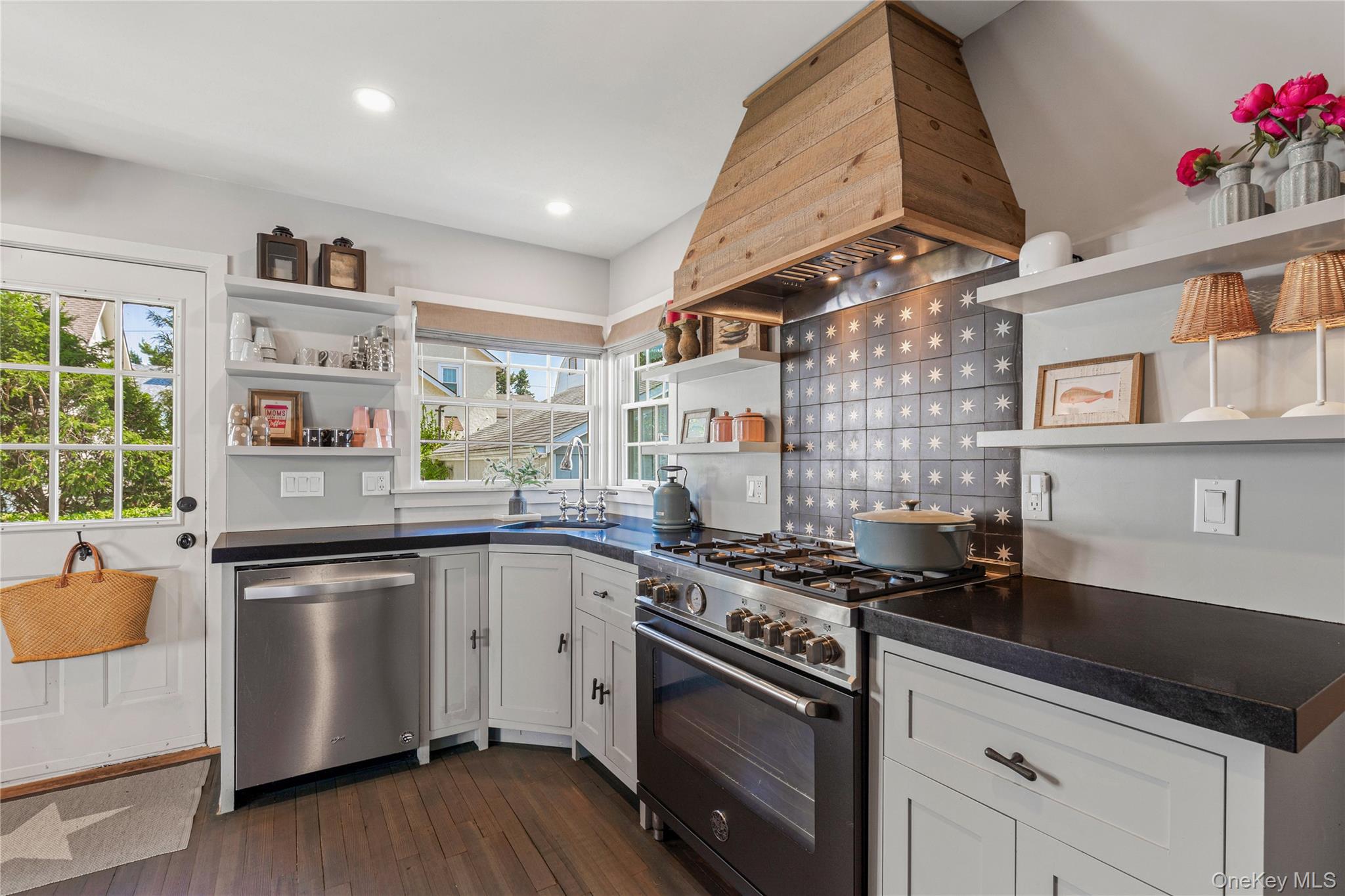 321 Rye Beach Avenue Rye, NY 10580 - Photo 20 of 36 Kitchen with open shelves, dark countertops, gas stove, custom exhaust hood, and white cabinetry