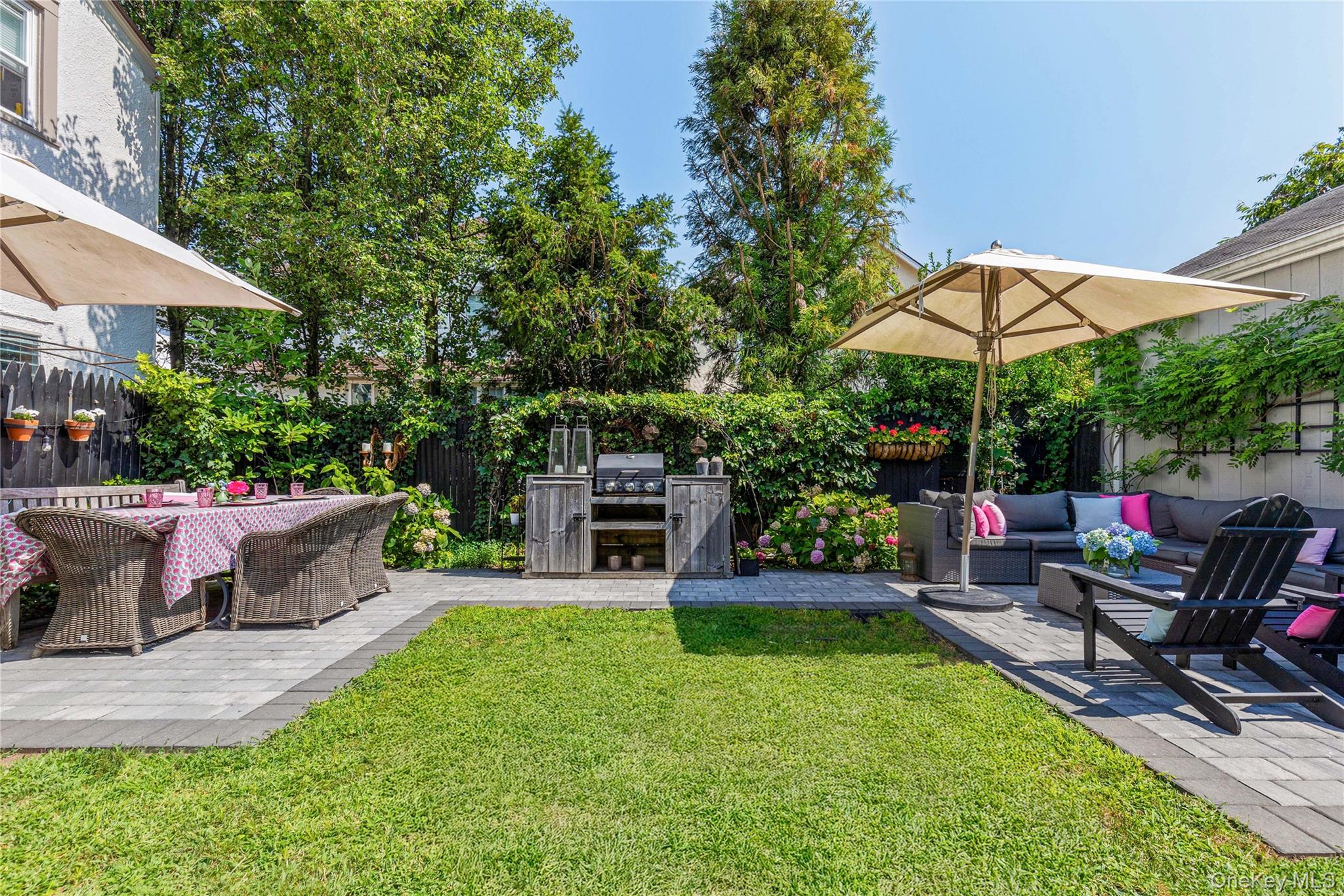321 Rye Beach Avenue Rye, NY 10580 - Photo 29 of 36 Fenced backyard featuring a patio area, an outdoor kitchen, and an outdoor living space