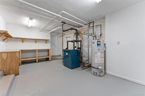 a wooden house with a tree in front of it