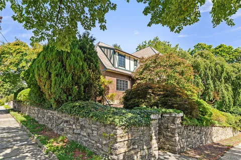 an aerial view of a house with a garden