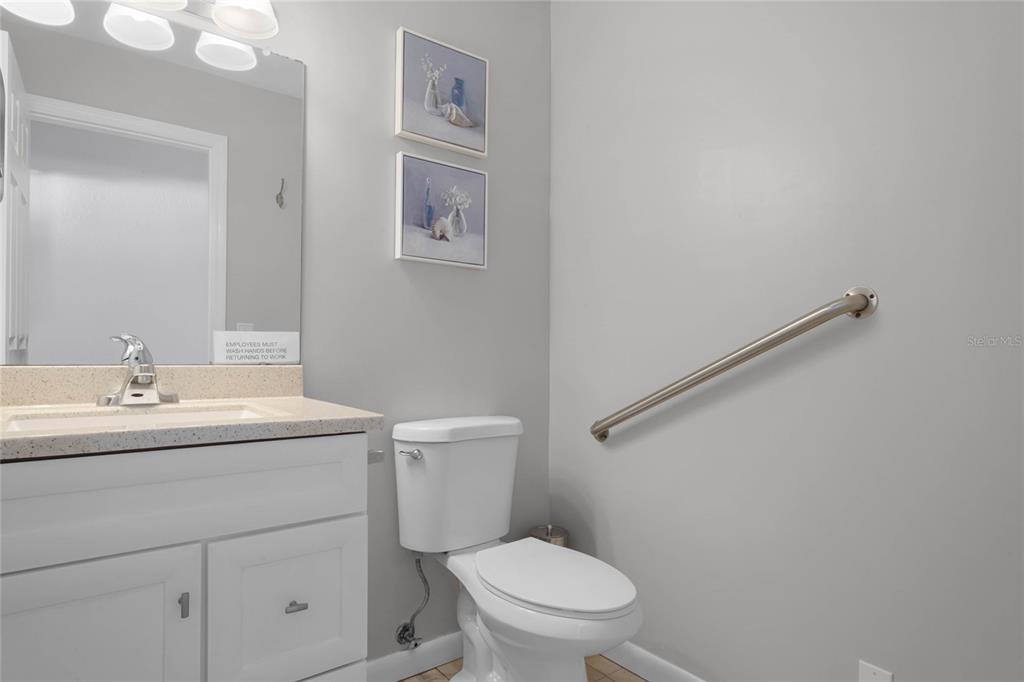 1312 Mardrake Road Daytona Beach, FL 32114 - Photo 11 of 33 a bathroom with a toilet sink and mirror