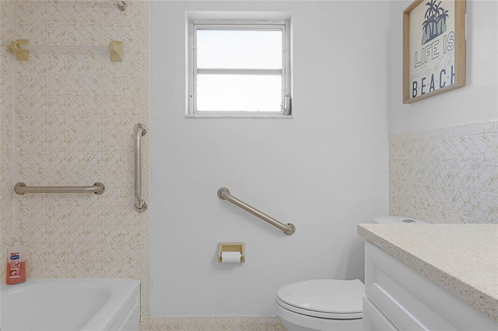 1312 Mardrake Road Daytona Beach, FL 32114 - Photo 20 of 33 a bathroom with a toilet and a bathtub