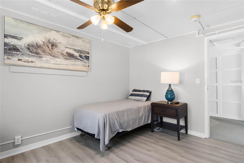 1312 Mardrake Road Daytona Beach, FL 32114 - Photo 10 of 33 a bedroom with a bed and a painting on the wall