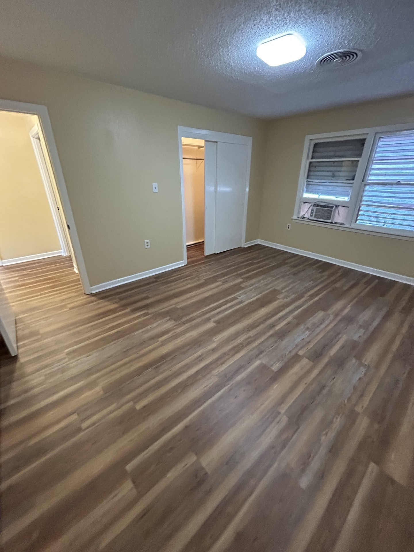 2109 Briar Lane La Marque, TX 77568 - Photo 13 of 20 a view of an empty room with wooden floor and a window
