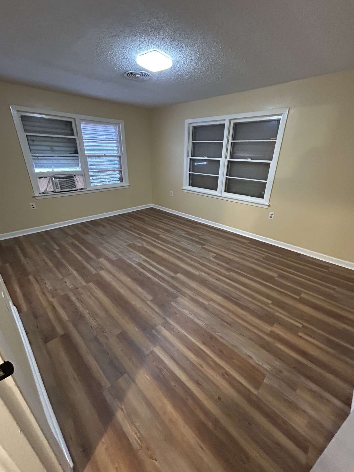 2109 Briar Lane La Marque, TX 77568 - Photo 14 of 20 a view of an empty room with wooden floor and windows