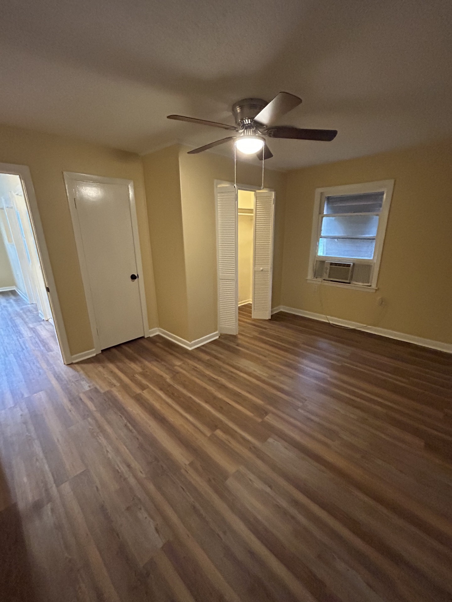 2109 Briar Lane La Marque, TX 77568 - Photo 16 of 20 a view of an empty room with wooden floor and a ceiling fan