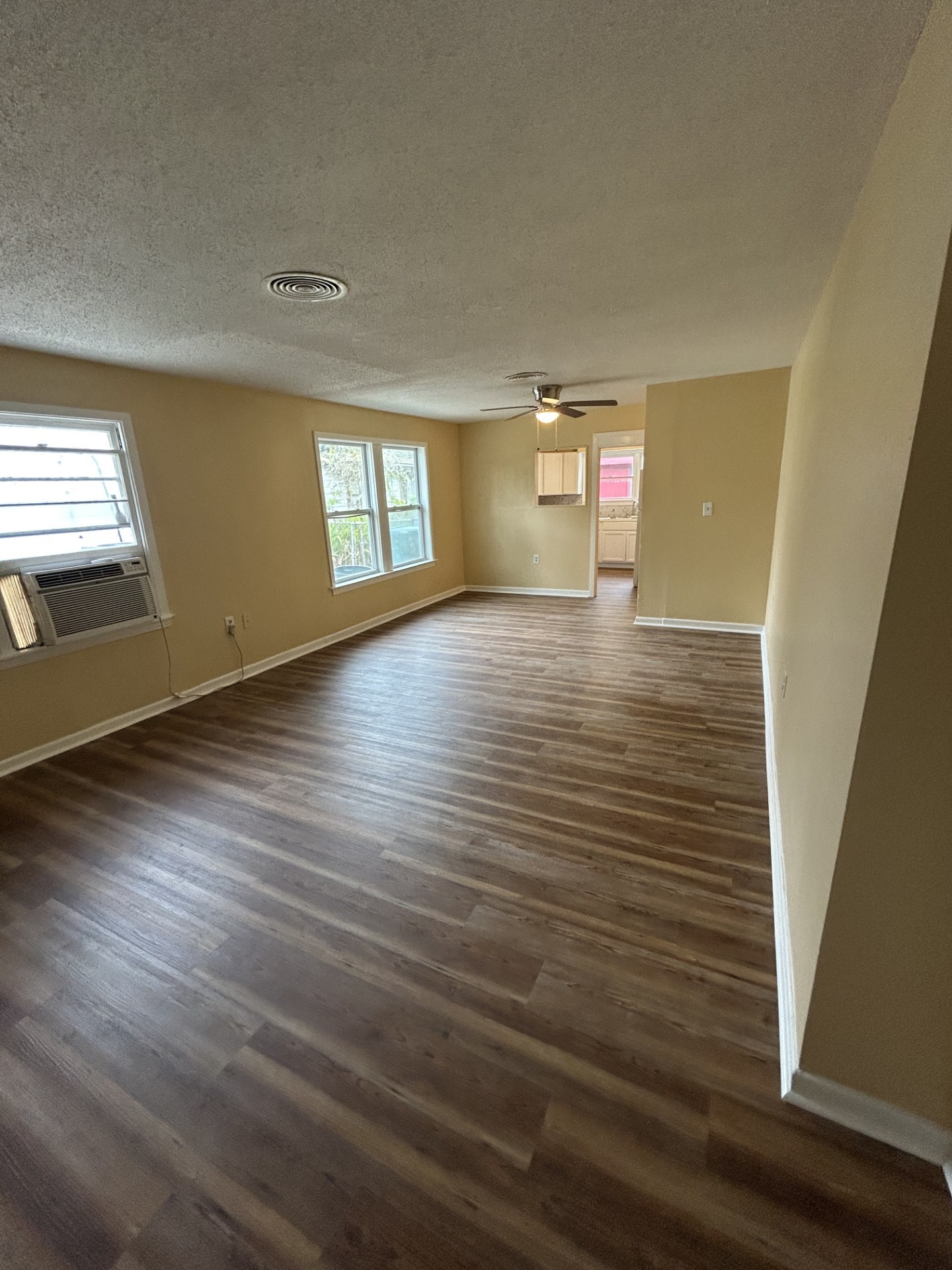 2109 Briar Lane La Marque, TX 77568 - Photo 5 of 20 an empty room with wooden floor and windows