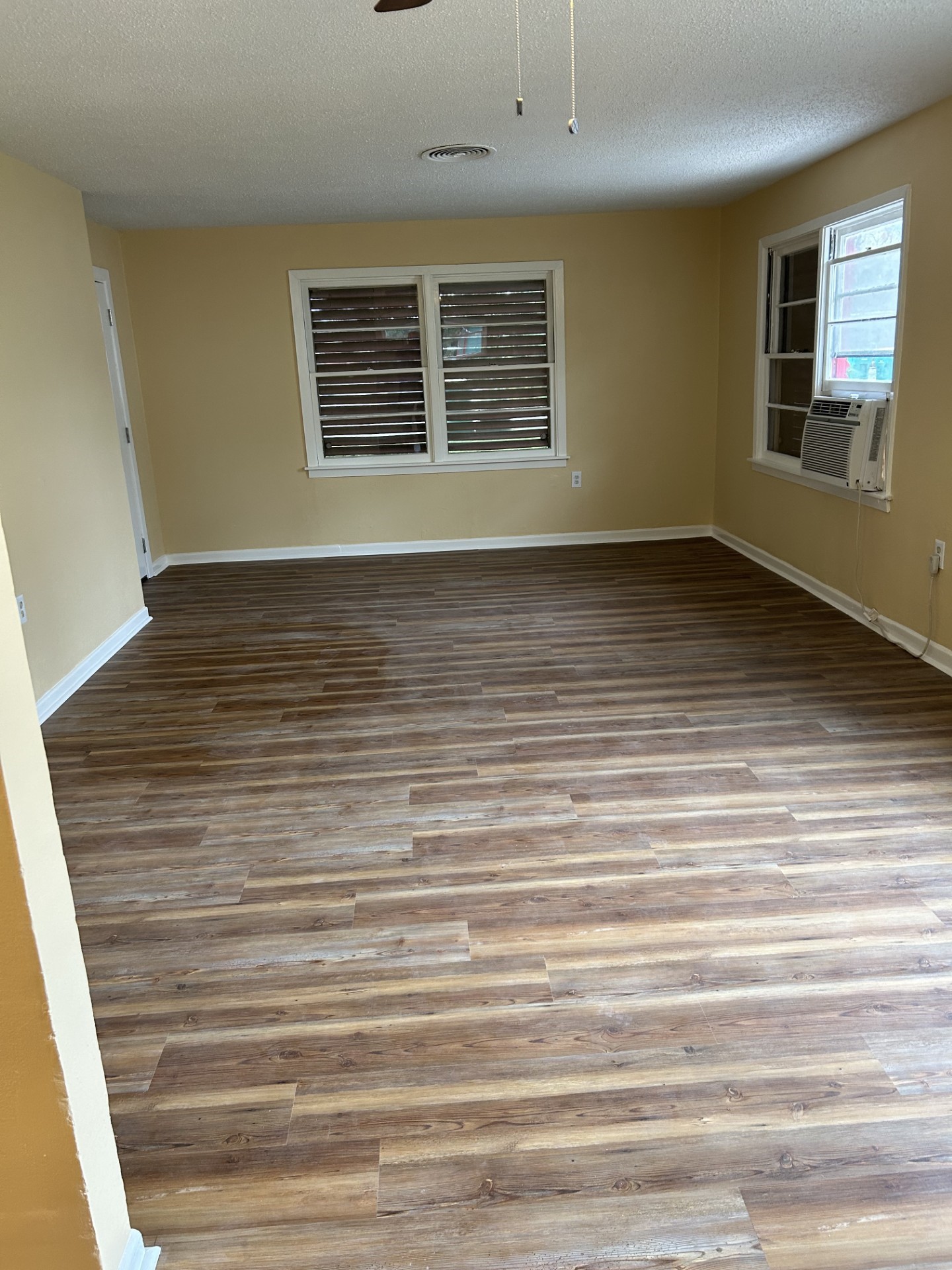 2109 Briar Lane La Marque, TX 77568 - Photo 6 of 20 a view of an empty room with wooden floor and a window