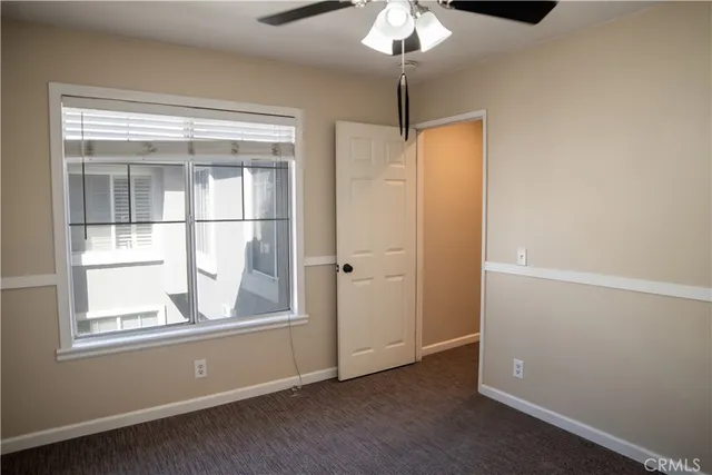 a view of a patio with table and chairs potted plants and palm tree