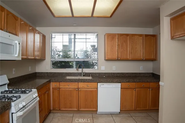 a kitchen with sink cabinets and window