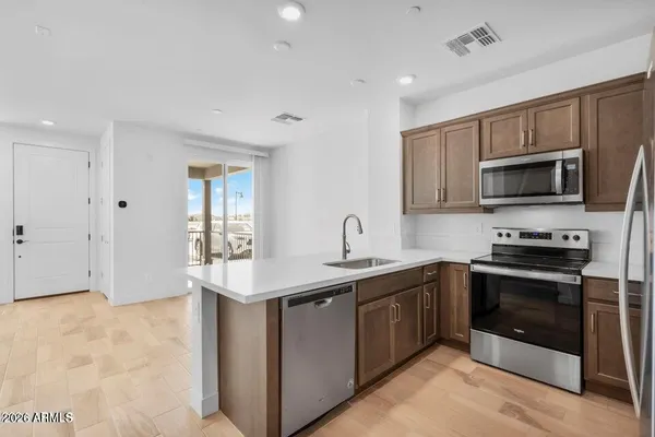 a kitchen with sink and window