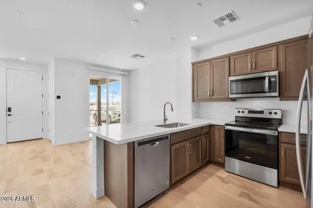 a kitchen with sink and window