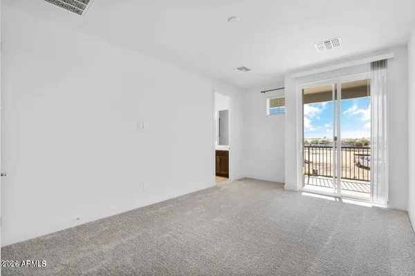 an empty room with closet area