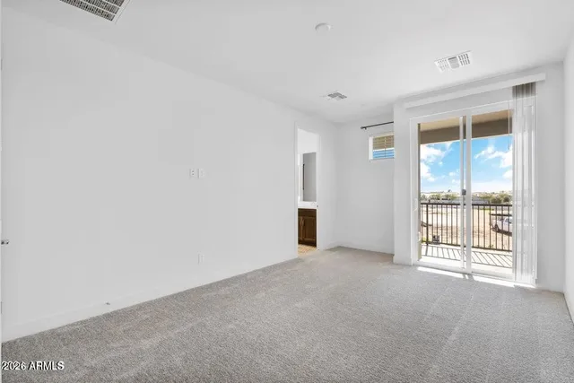 an empty room with closet area