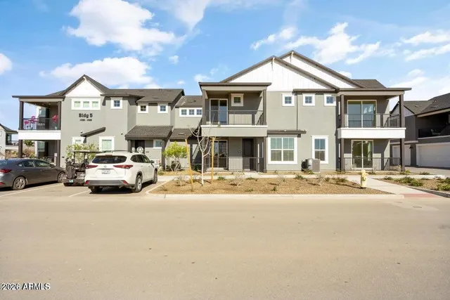 a car parked in front of a houses