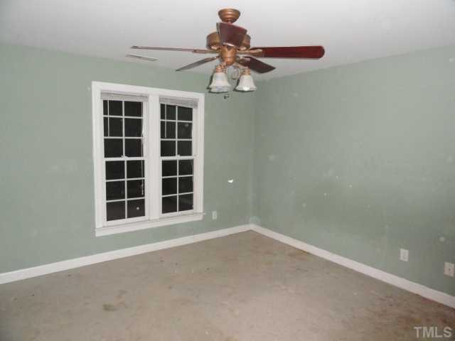 9341 Woodlief Road Wake Forest, NC 27587 - Photo 8 of 10 a view of an empty room with a window