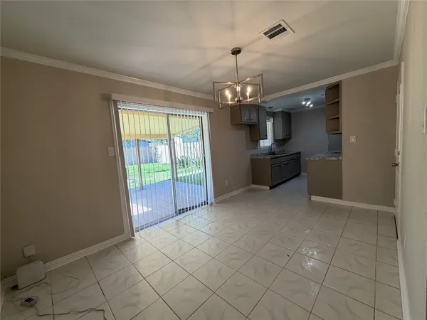 a kitchen with granite countertop a sink and a stove