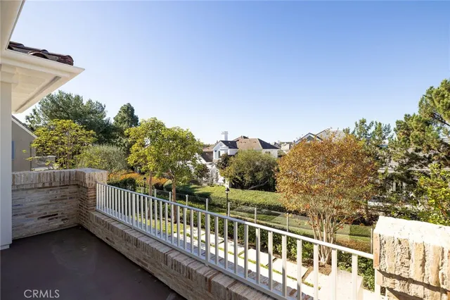 a view of a balcony with wooden fence