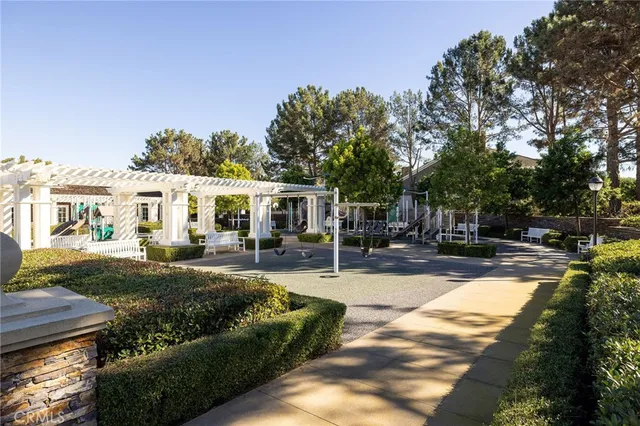 a view of a house with swimming pool and sitting area