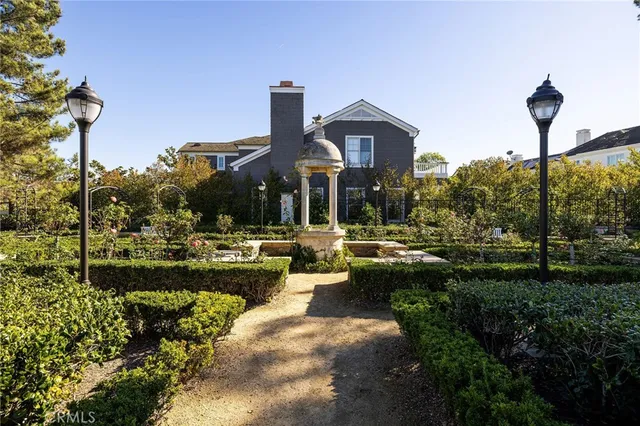 a front view of a house with swimming pool having outdoor seating