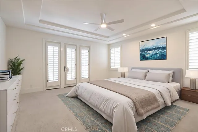 a spacious bedroom with a large bed and a large window