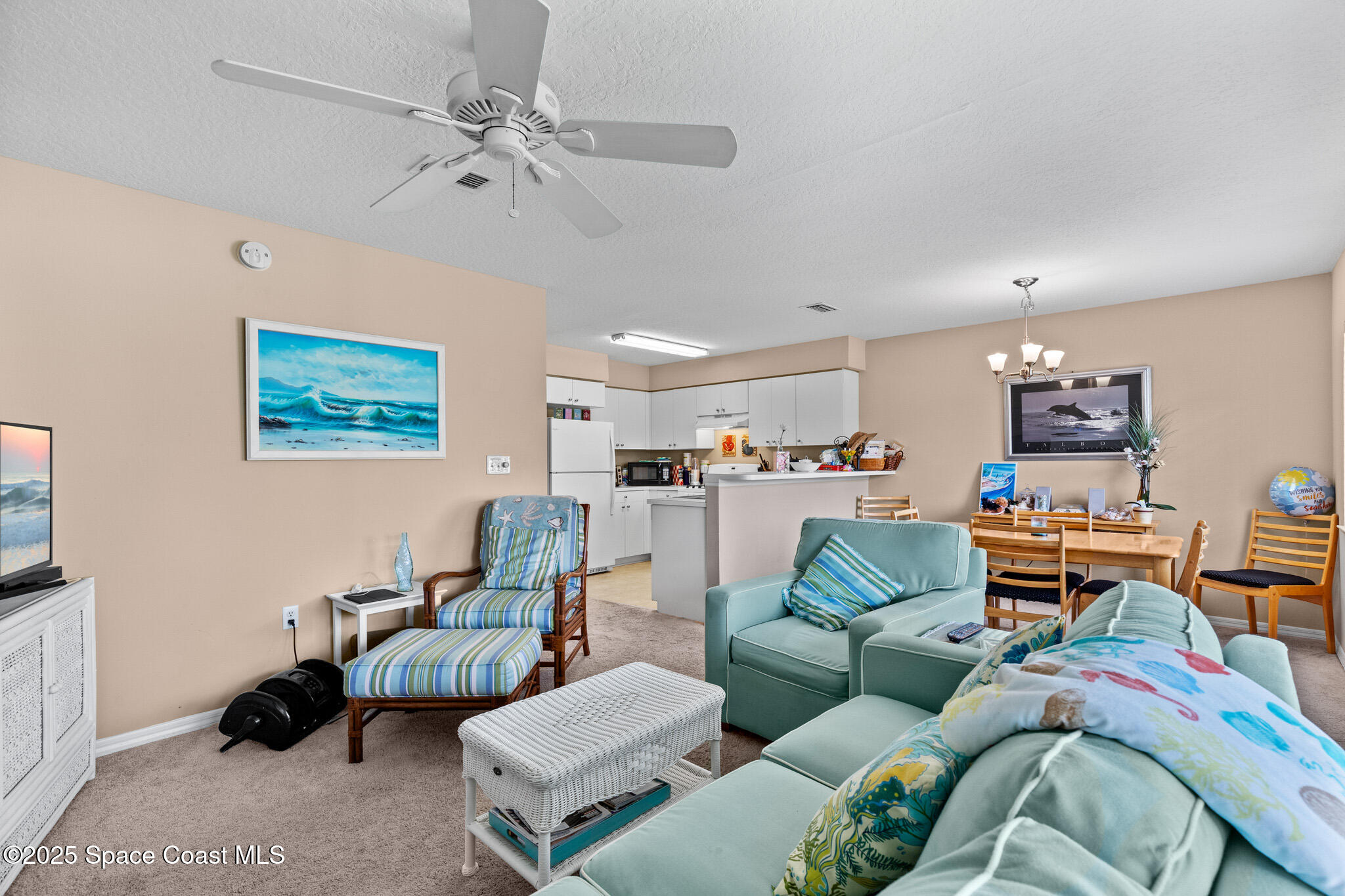 243 Forecast Lane, Unit 421 Rockledge, FL 32955 - Photo 18 of 43 a living room with furniture and a view of kitchen