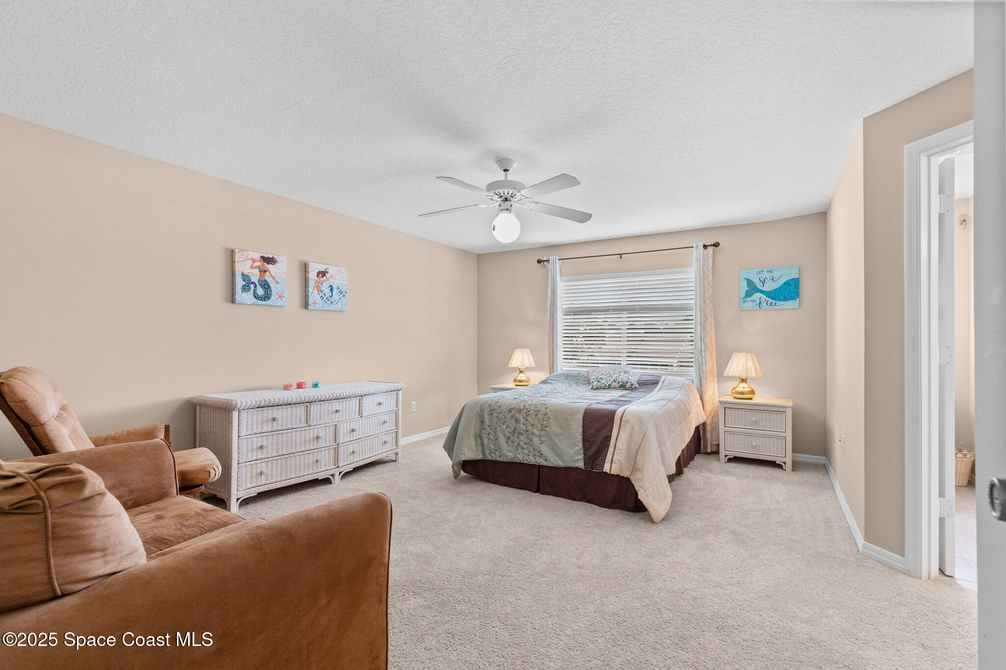 243 Forecast Lane, Unit 421 Rockledge, FL 32955 - Photo 20 of 43 a spacious bedroom with a bed and window