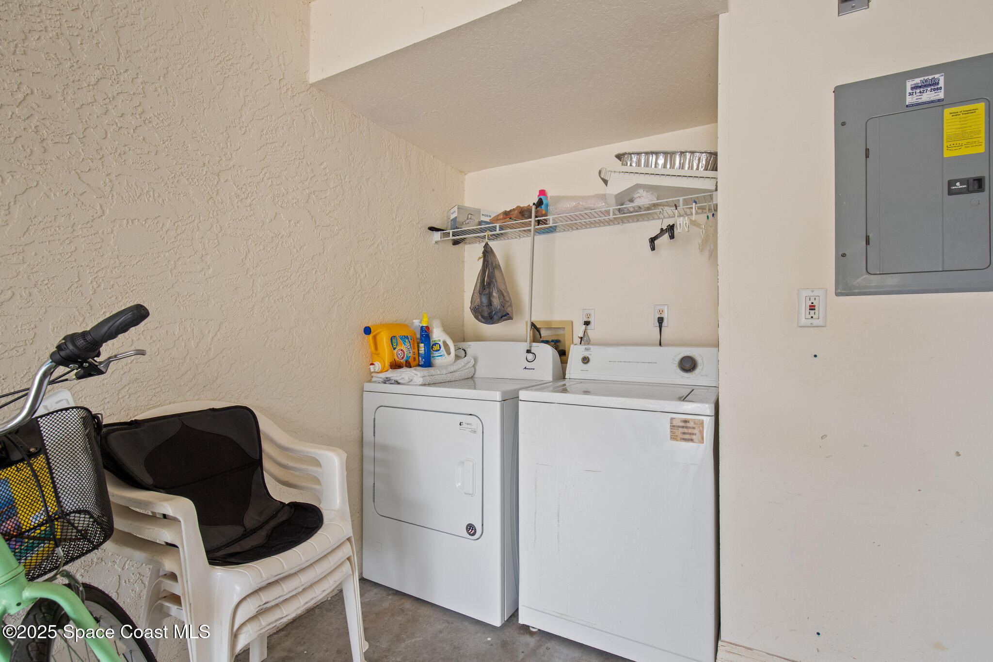 243 Forecast Lane, Unit 421 Rockledge, FL 32955 - Photo 26 of 43 a utility room with dryer and washer