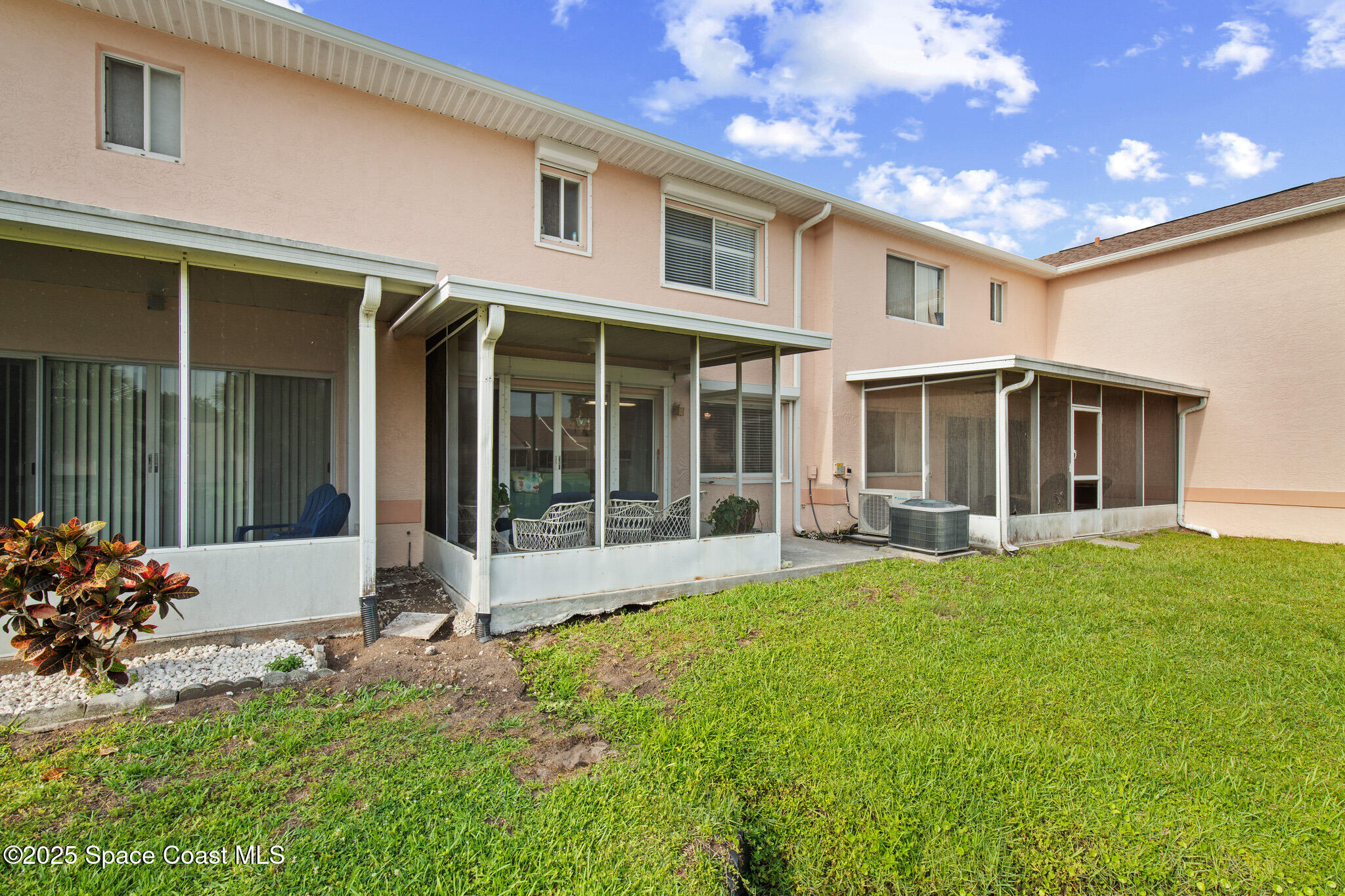 243 Forecast Lane, Unit 421 Rockledge, FL 32955 - Photo 30 of 43 a front view of a house with a yard