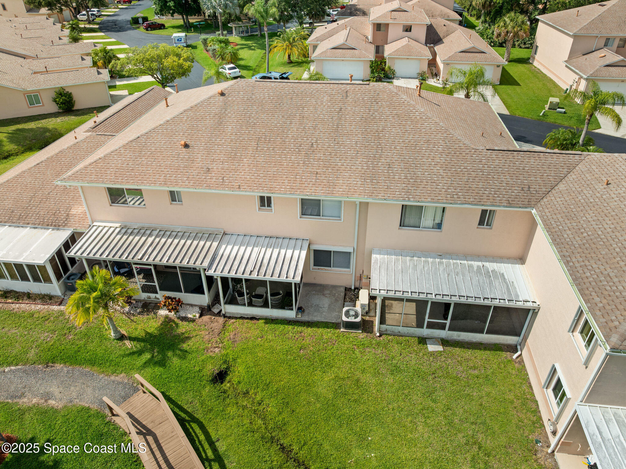 243 Forecast Lane, Unit 421 Rockledge, FL 32955 - Photo 31 of 43 an aerial view of a house with a garden and deck