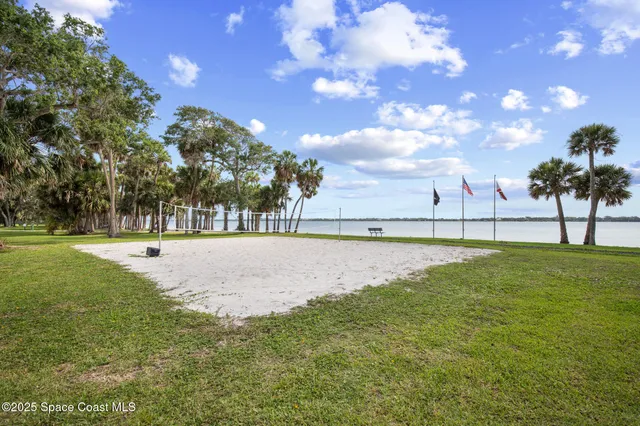a view of swimming pool with a yard