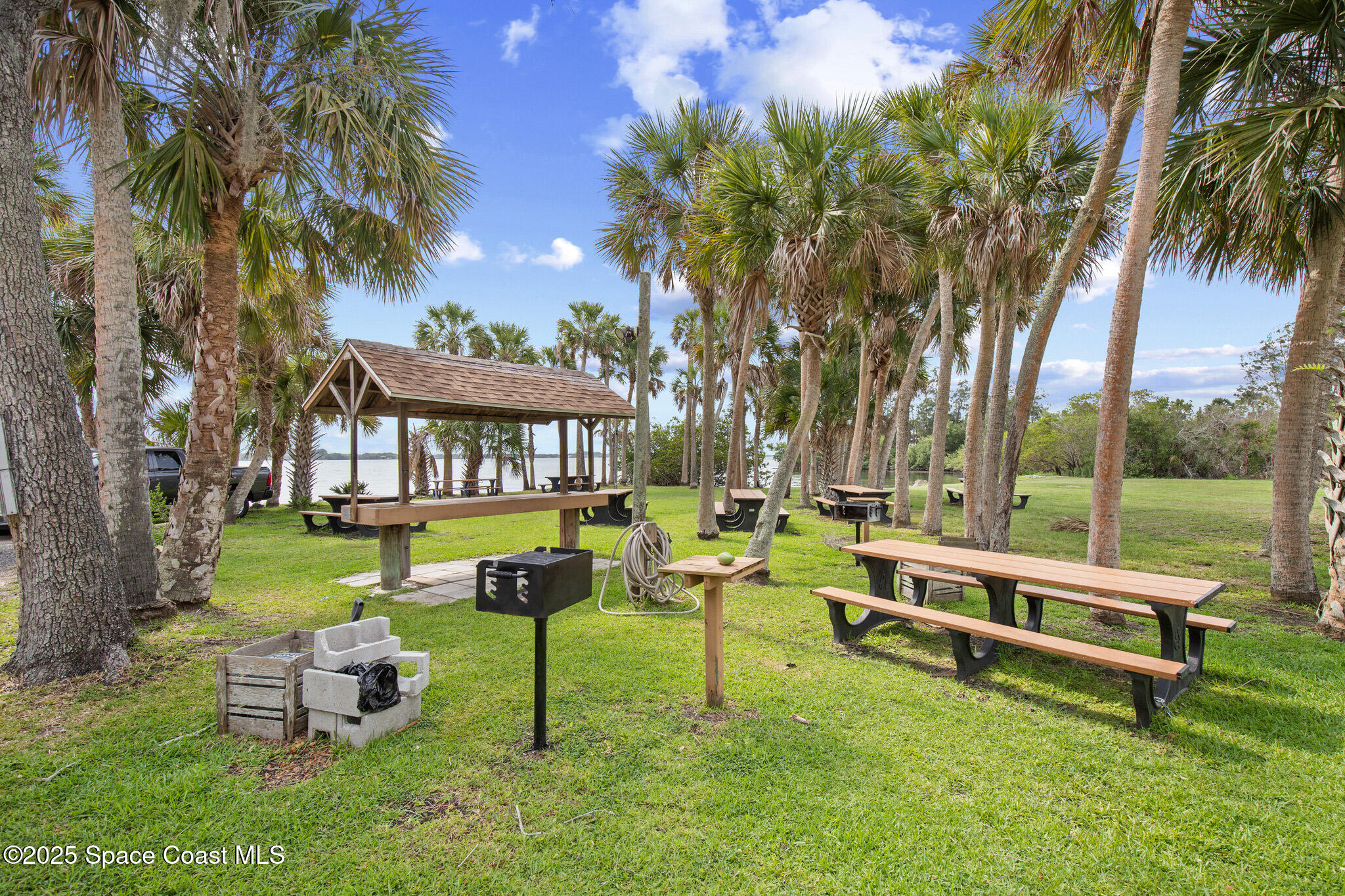 243 Forecast Lane, Unit 421 Rockledge, FL 32955 - Photo 38 of 43 a swimming pool with outdoor seating and yard
