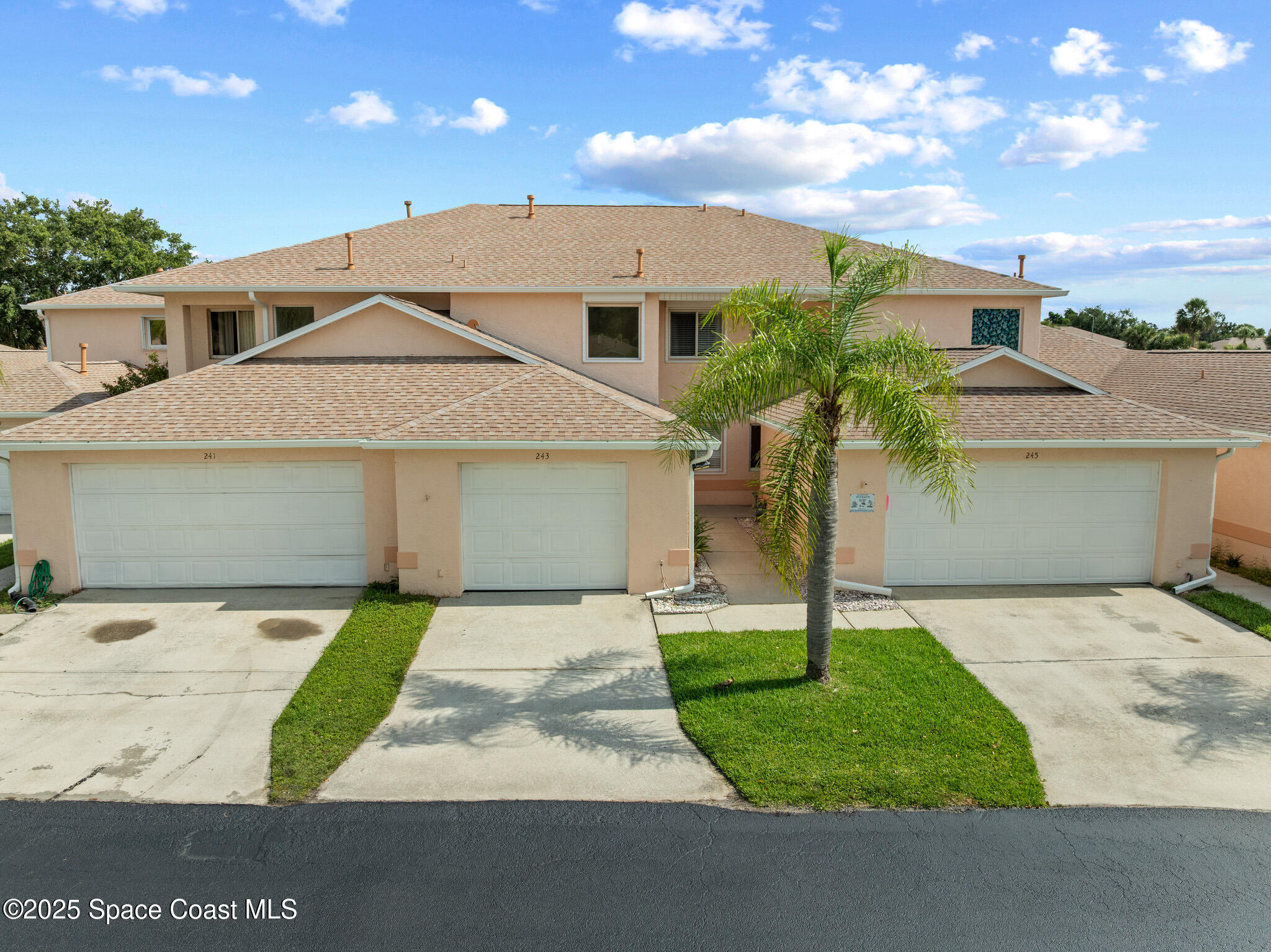 243 Forecast Lane, Unit 421 Rockledge, FL 32955 - Photo 4 of 43 a front view of a house with garden