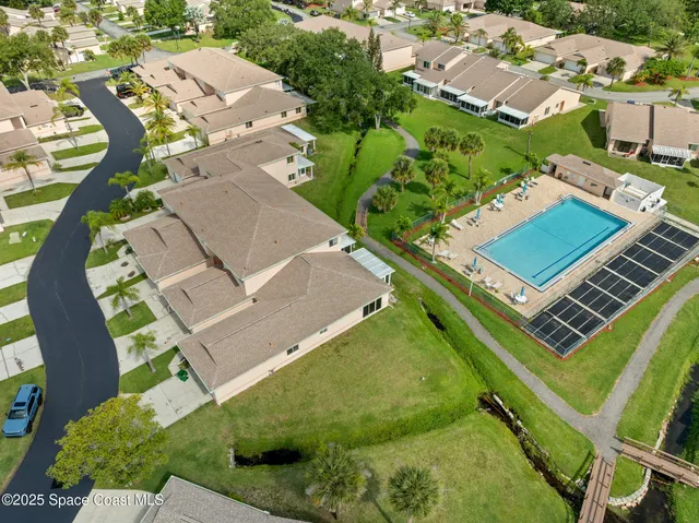 an aerial view of a house with a garden